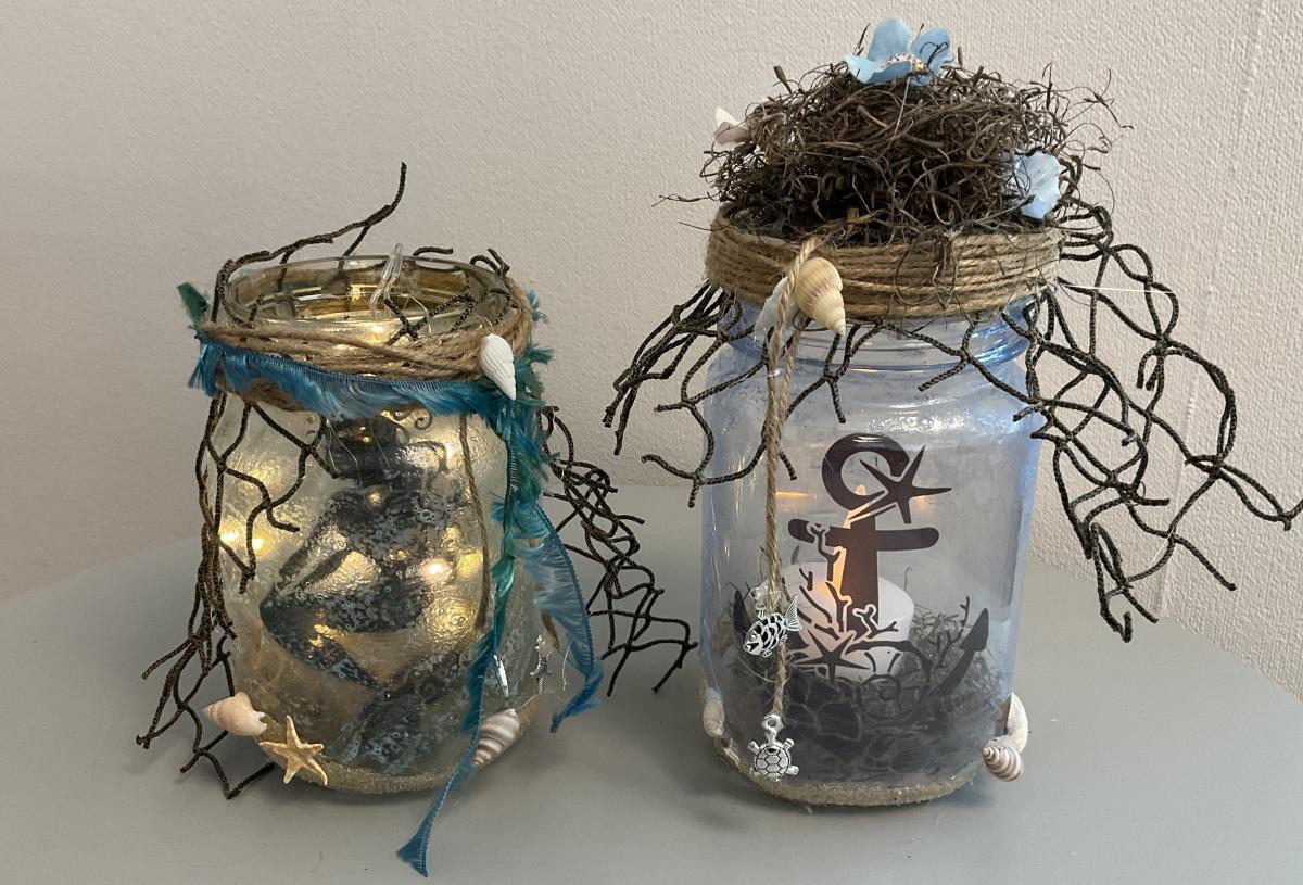 Jar with mermaid silhouette and jar with anchor silhouette
