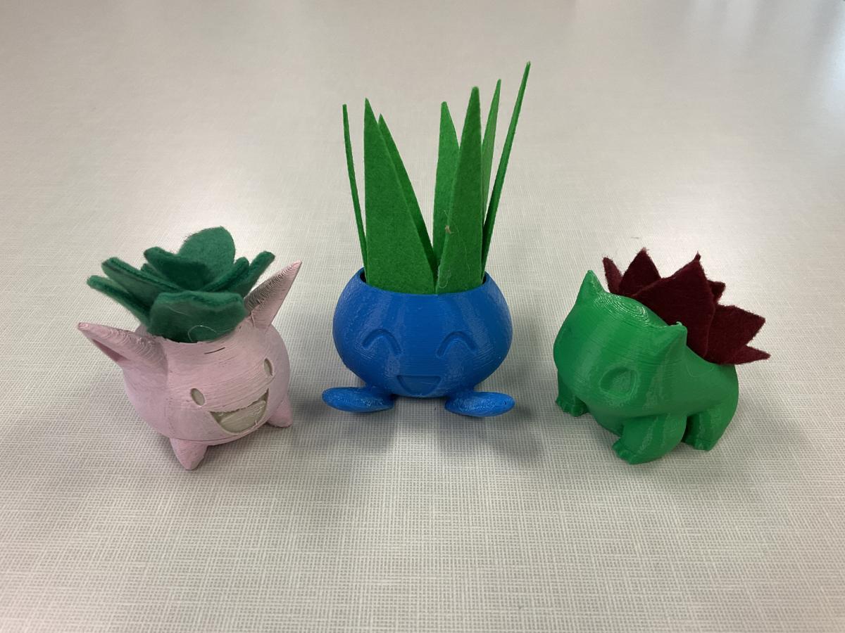 pink Hoppip planter, blue Oddish planter, and green Bulbasuar planter with felt succulent