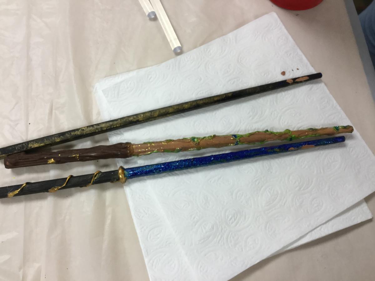 three decorated wands