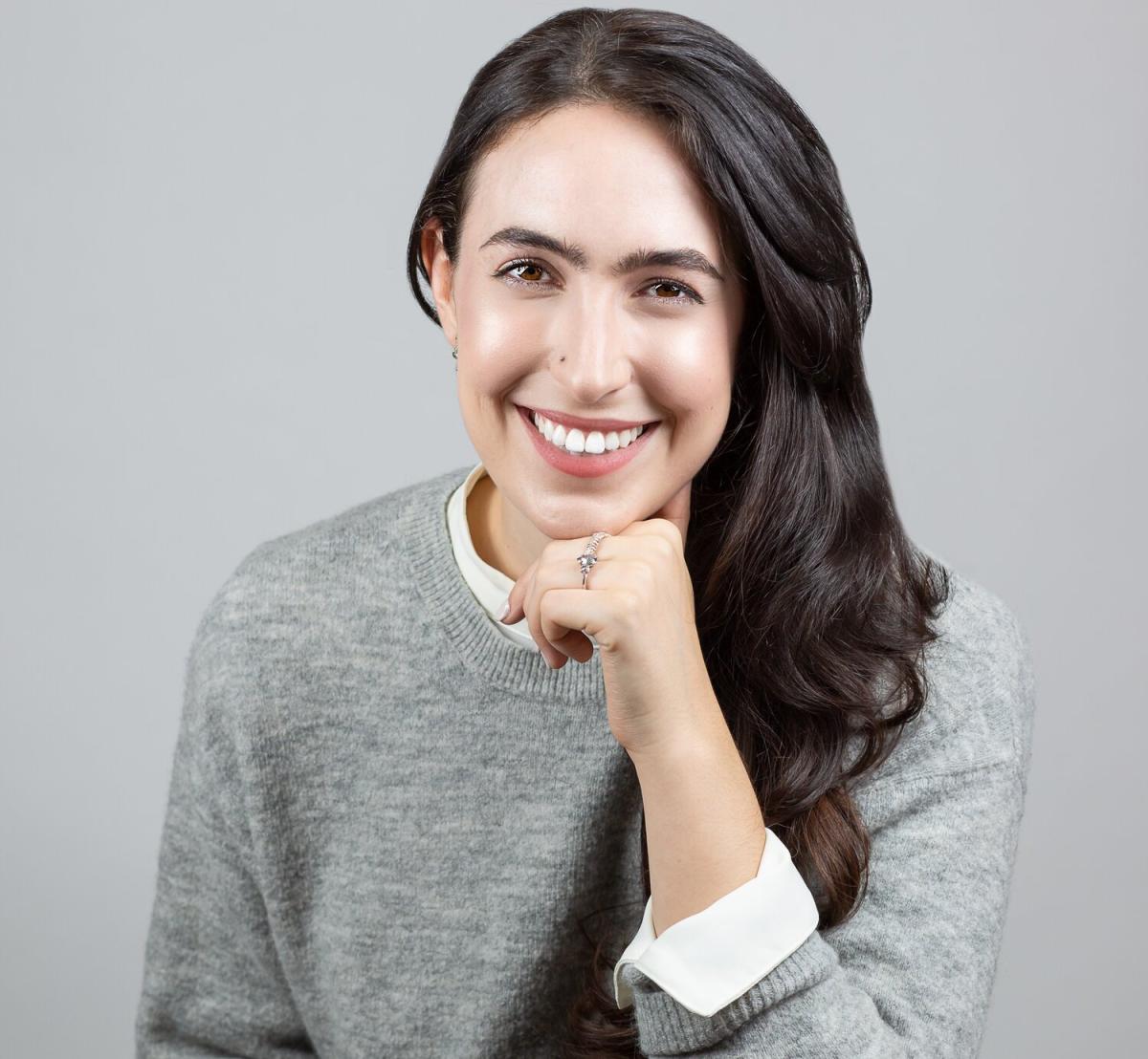 photo of smiling amanda foody in grey sweater