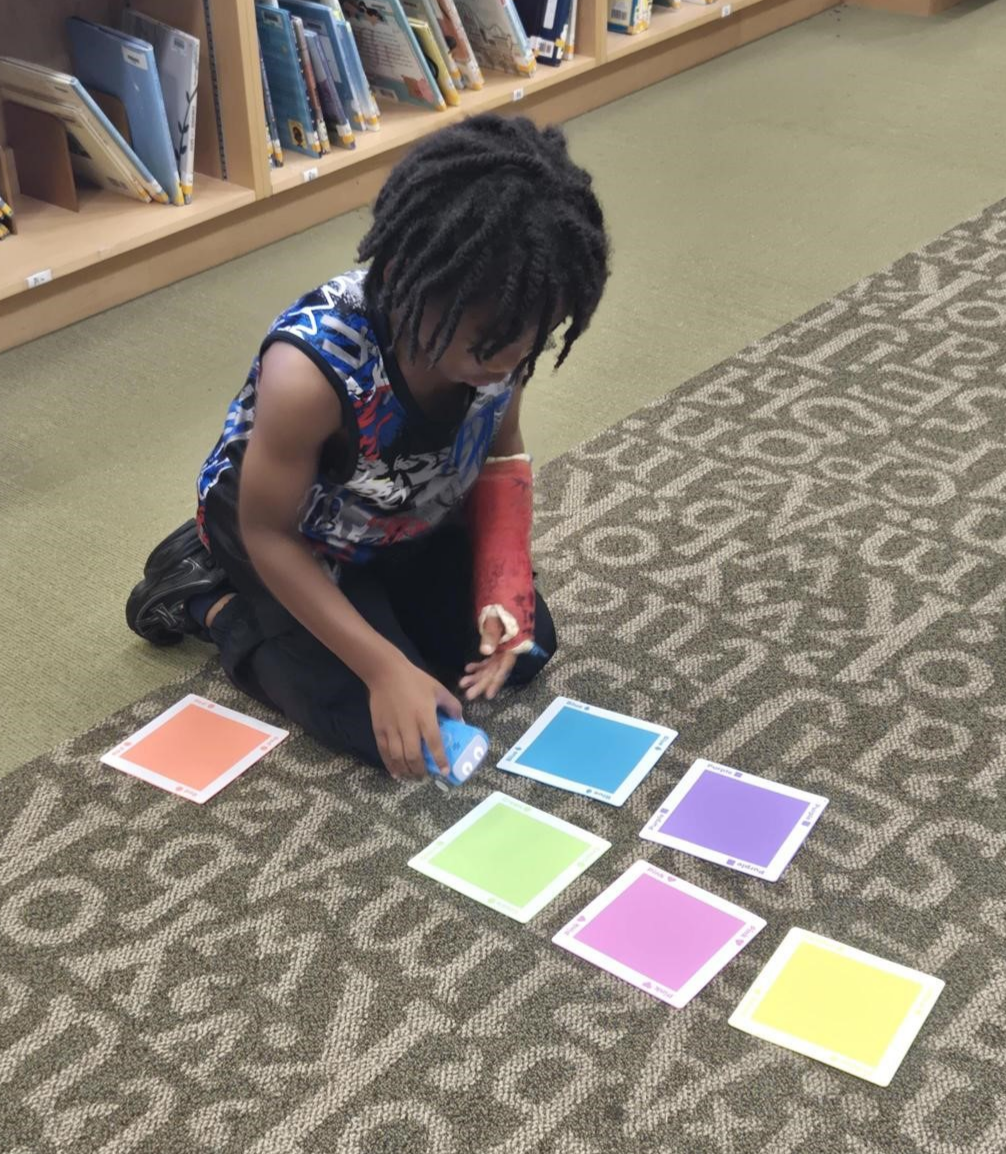 child playing with Sphero indi coding robot