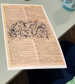 flower stamp on dictionary page