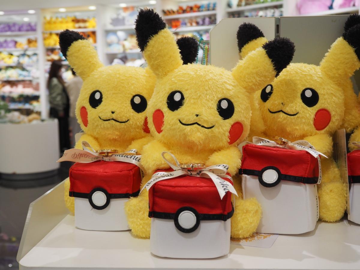 3 Pikachu stuffed animals holding Pokeball giftboxes