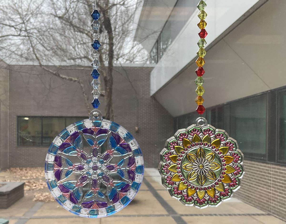 2 suncatchers against a window