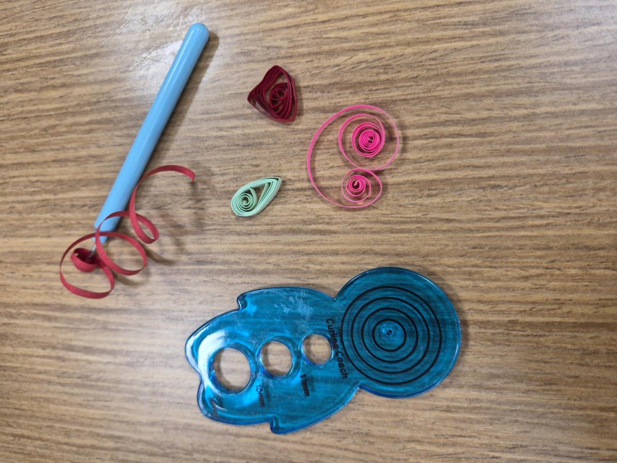 Paper quilling tools and paper strips